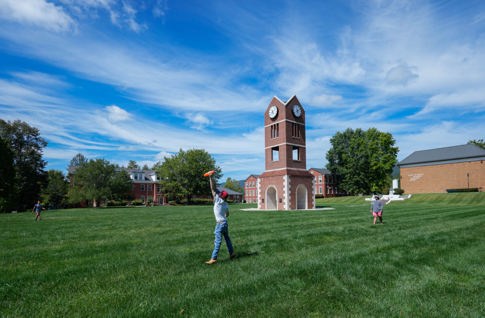 Students playing frisbee on the campus of LMU.